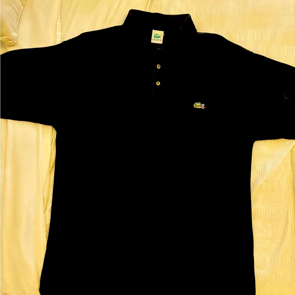 Black Men’s LaCoste polo size XL.